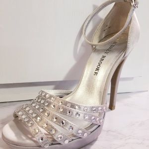 Silver ankle strap heels.